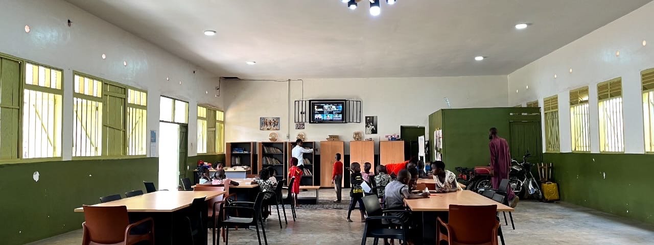The wide hall of KPDDI's community centre in Kireka