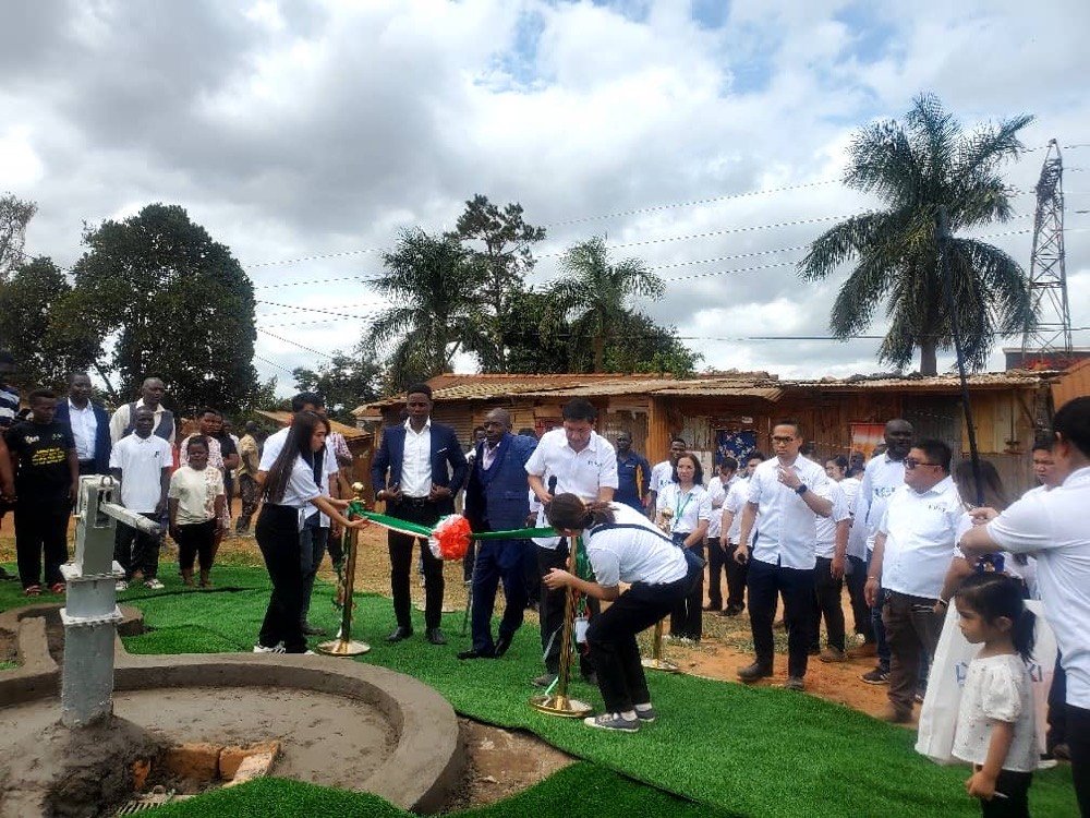 KPDDI's compound in Kireka with the new borehole water point and community members